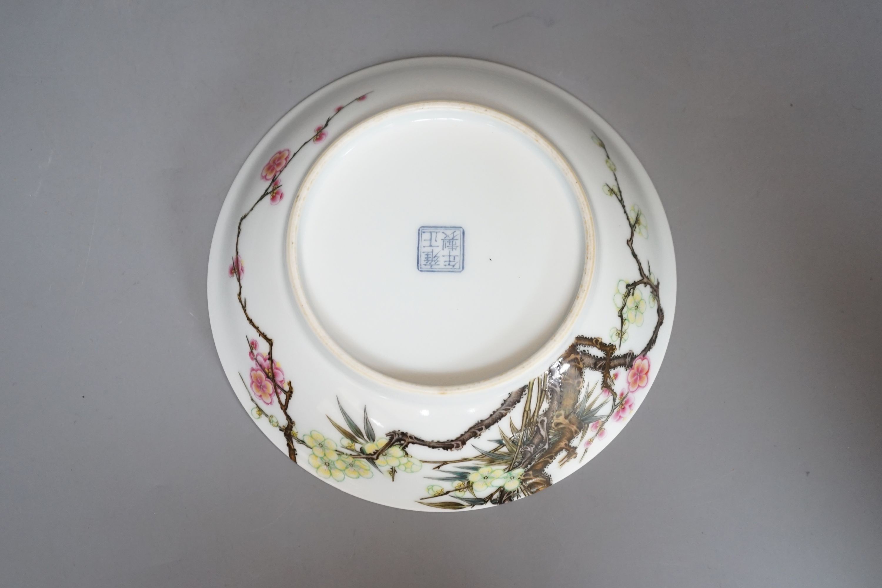 A boxed Chinese famille rose saucer dish, Yongzheng mark, 17 cms diameter.